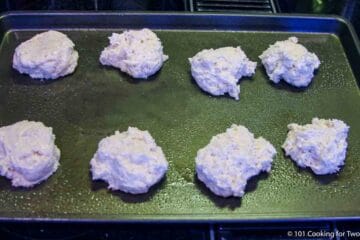 Drop biscuits on a baking sheet.
