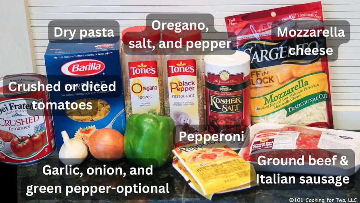 Ground meat with pasta and ingredients for crock pot pizza—labeled.