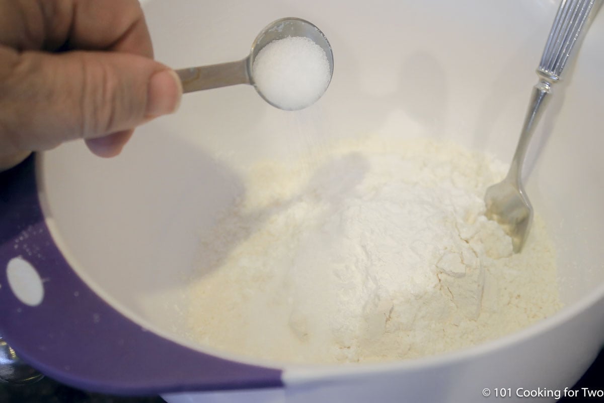 adding salt to flour.