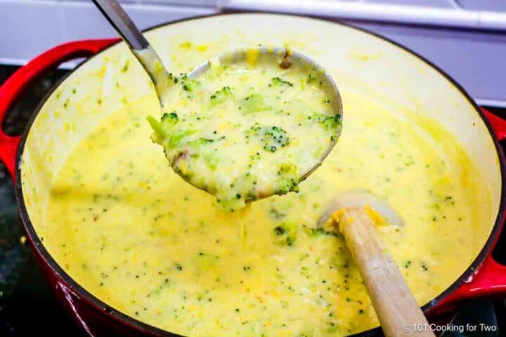 broccoli cheese soup in a ladle.