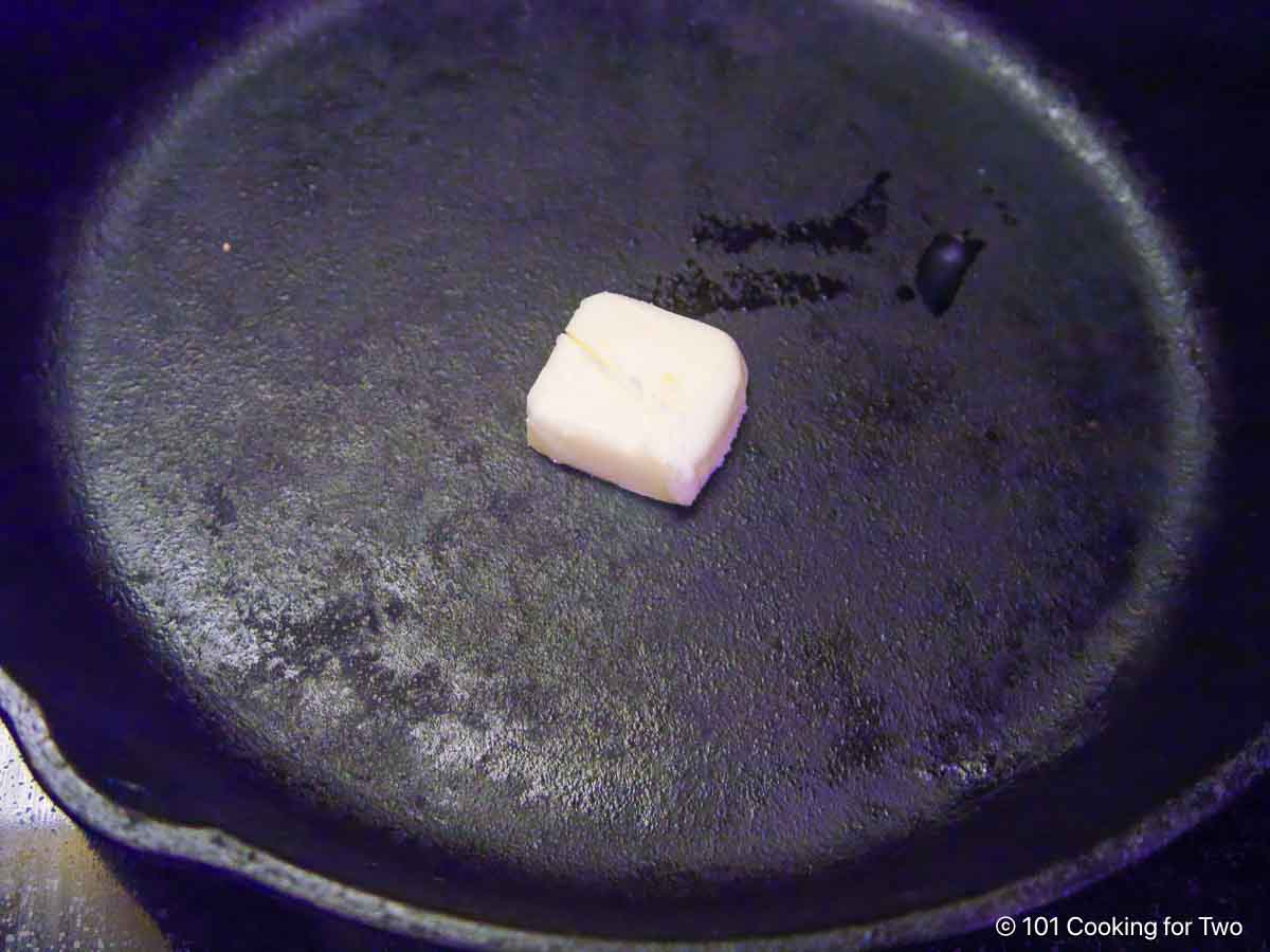 melting butter in a cast iron skillet.