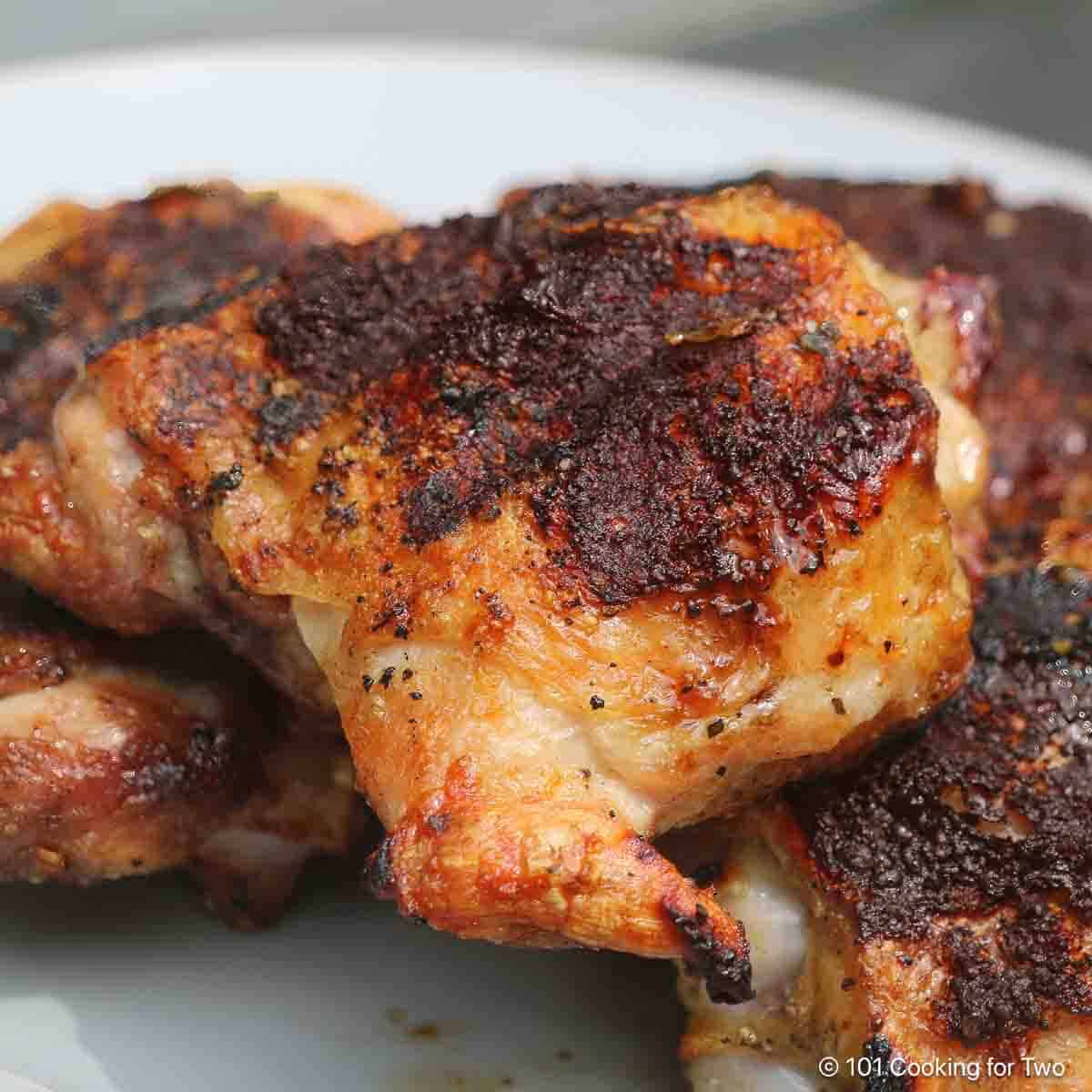 Grilled chicken with some crispy char on skin.