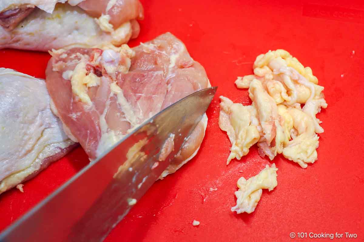 trim any fat off of chicken thighs.