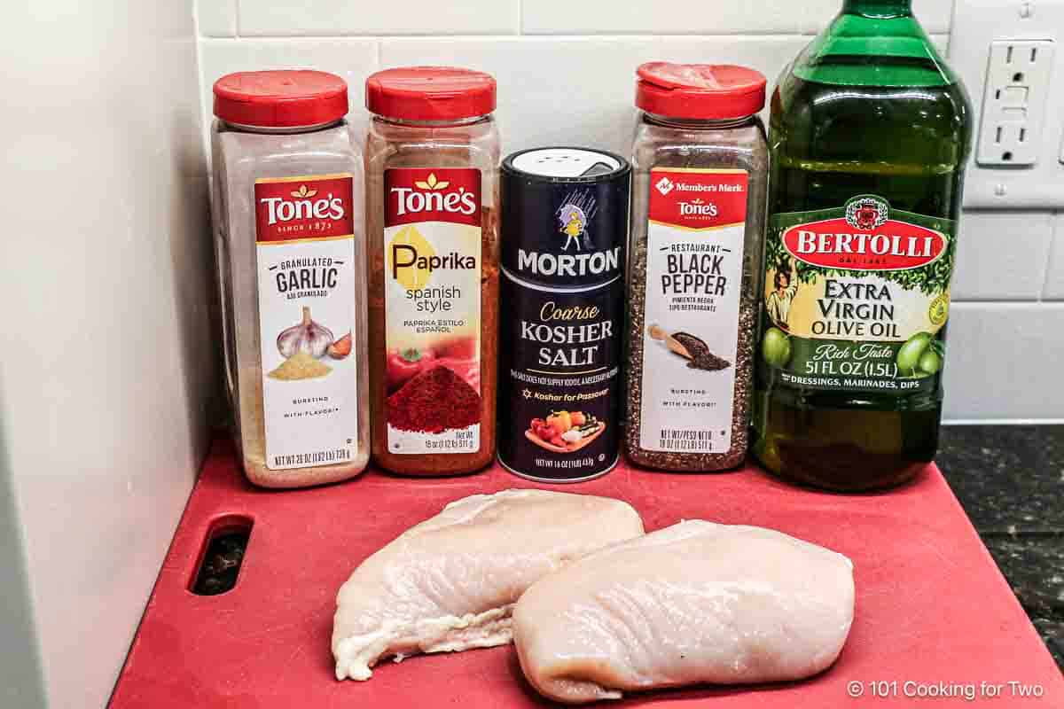 raw chicken breasts with seasoning.