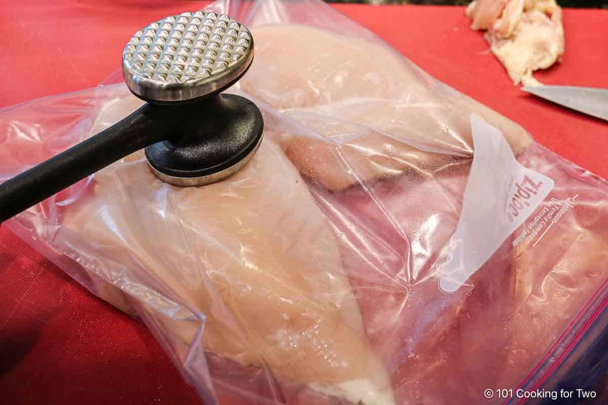 flattening chicken breasts.