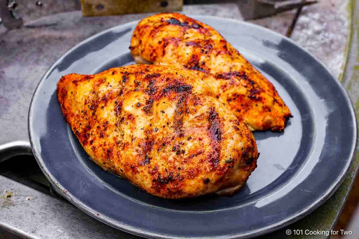 grilled chicken breasts on a plate.