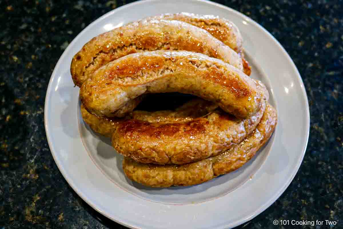 pile of cooked Italian sausage on plate.