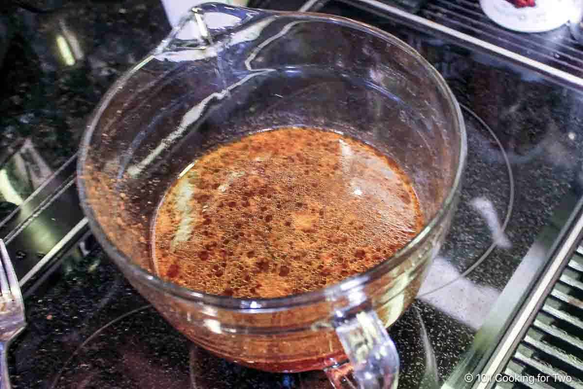 used braising fluid in a bowl.