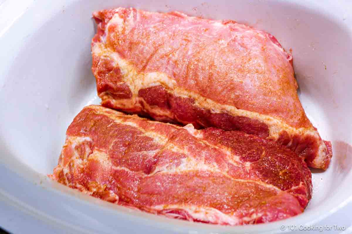 arrange ribs in the crock pot.