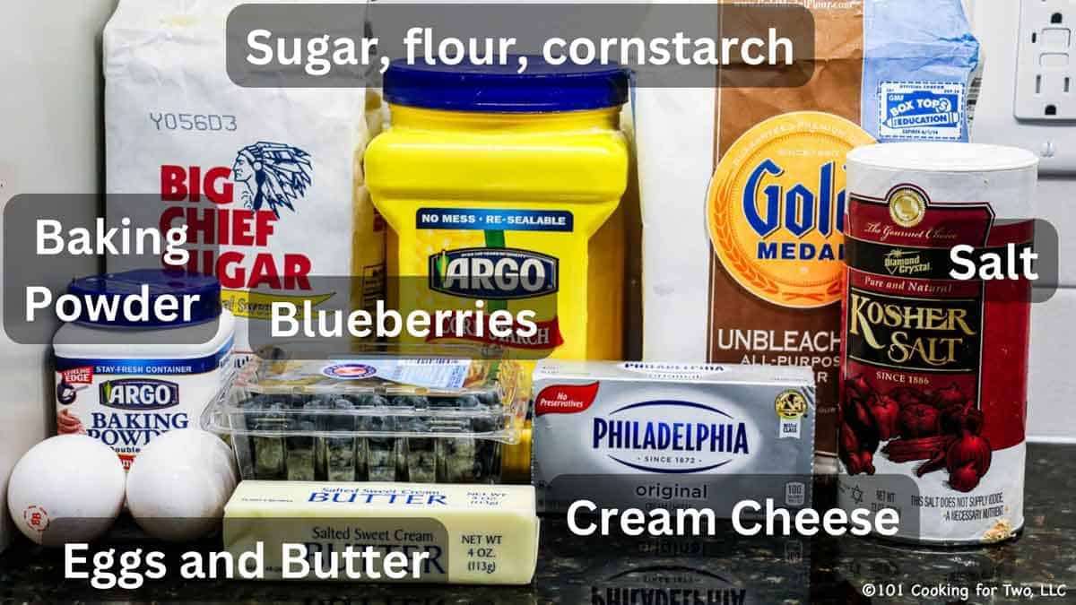 blueberries with ingredients for cream cheese bars labeled.