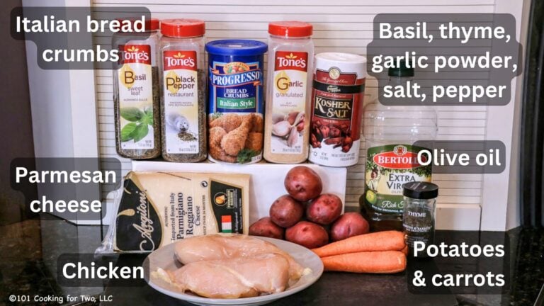 Raw chicken breasts with potatoes and carrots with seasonings—Labeled.