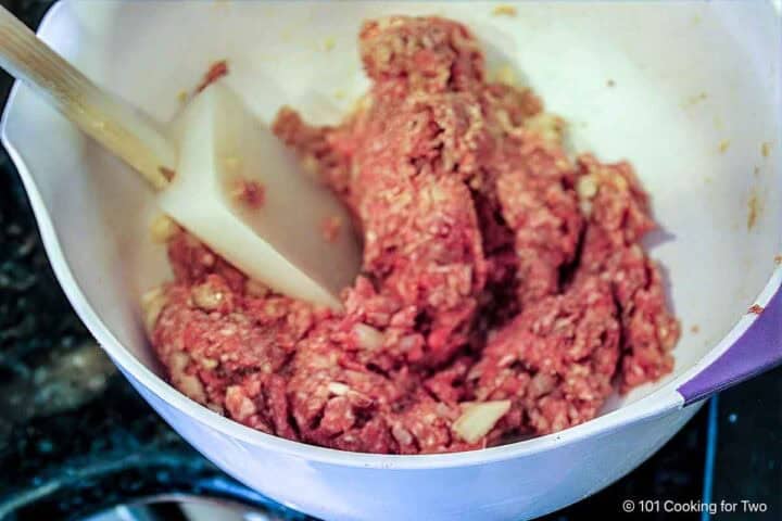 Mixing ground meat into the panade.