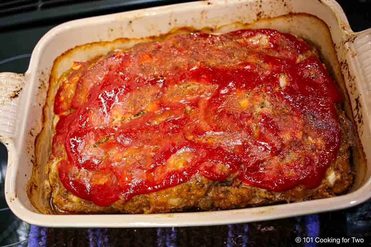 Cooked meatloaf in the pan.