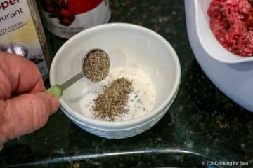 Mixing spices in a small bowl.