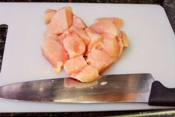 Trim chicken into cubes.