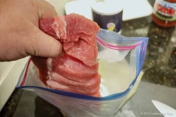 Brining boneless pork ribs.