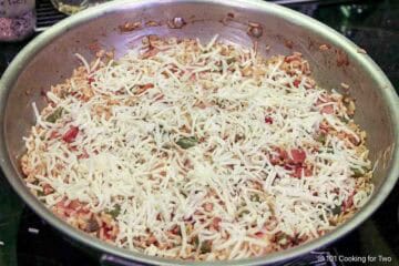 Cover the raw dish with cheese.