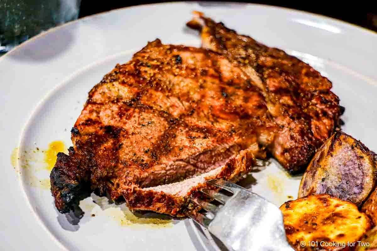 Grilled ribeye steak with potatoes.