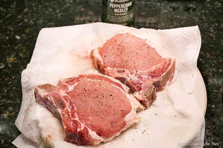 Seasoning pork chops.
