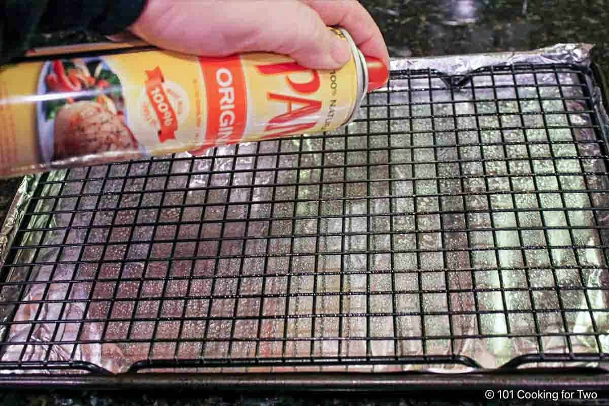 Preparing a tray with a rack and foil.