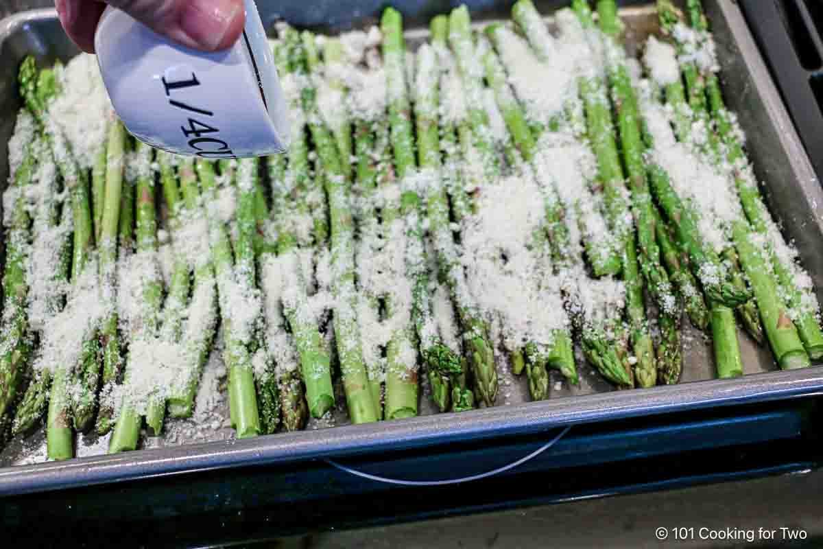 Sprinkle the asparagus with grated Parmesan.