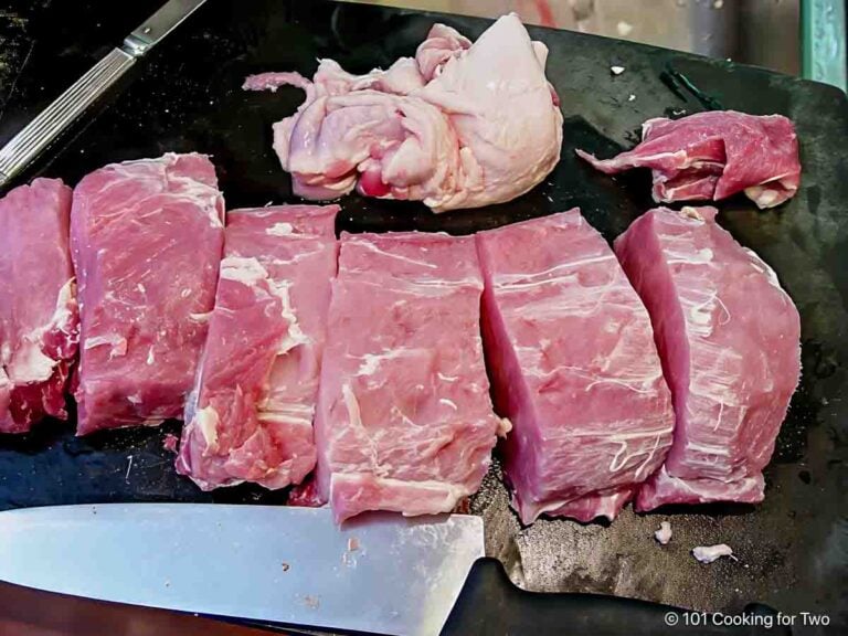 Trimmed pork loin on a board.