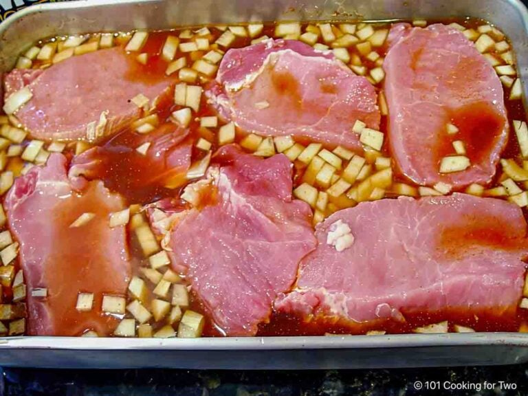 Place slices of pork loin in the braising fluid.