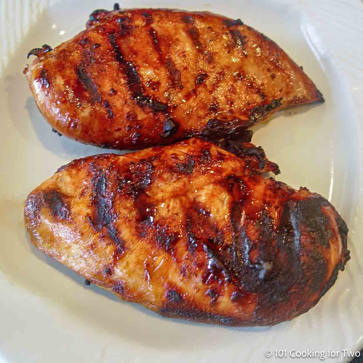 Quick Marinade For Grilled Chicken Breast from 101 Cooking for Two Grilled lemon-marinated chicken breasts on a plate.