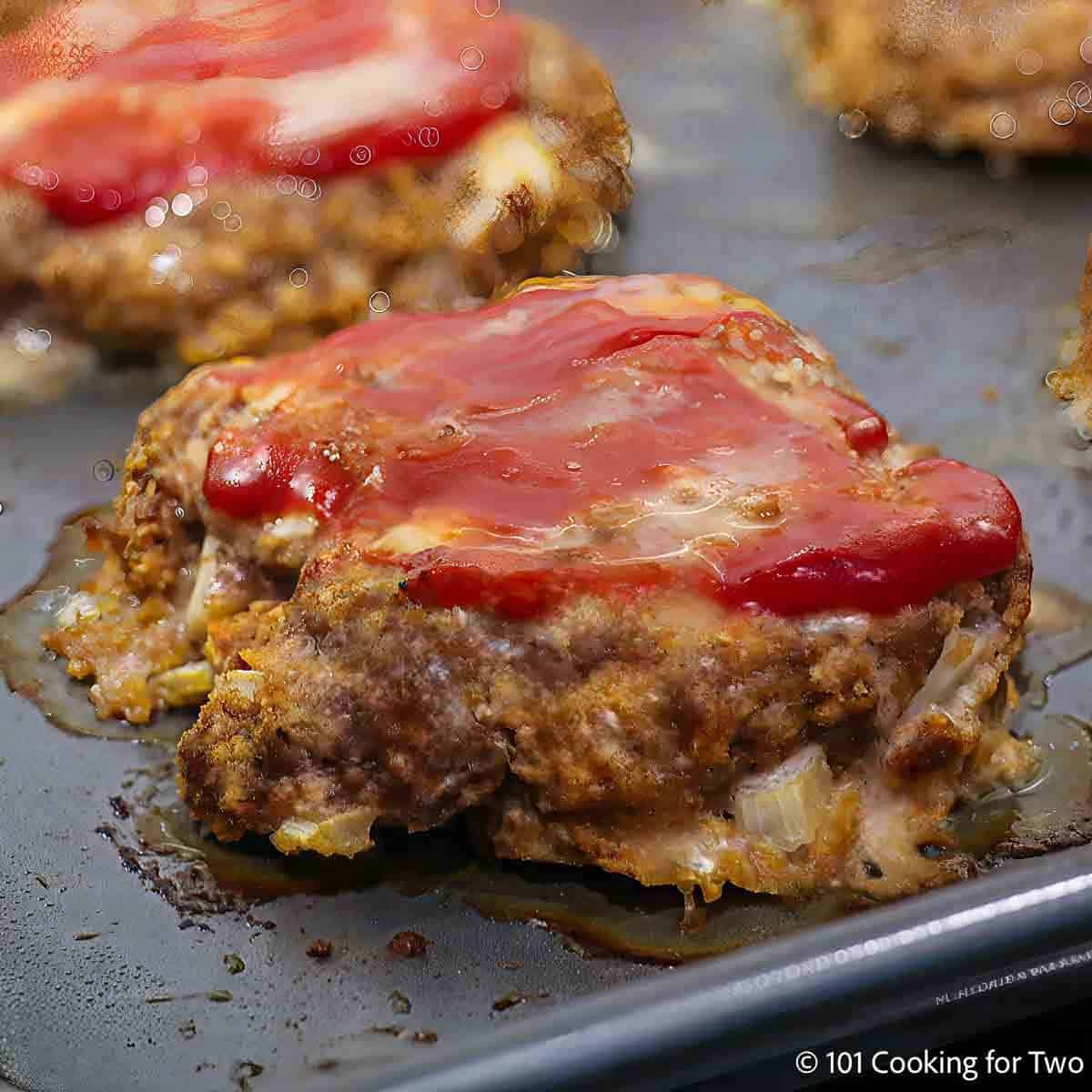 Baked meatloaf burger on the tray.