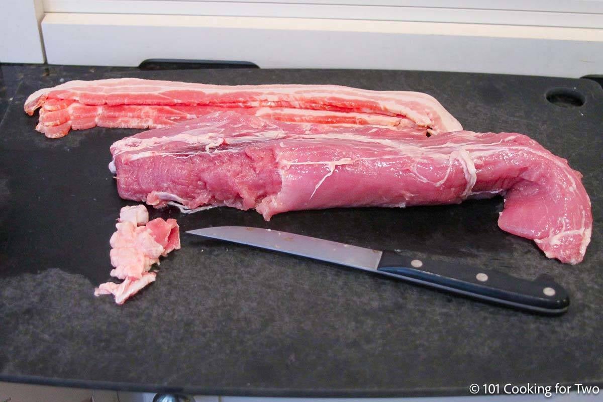 Trimmed pork tenderloin with bacon.