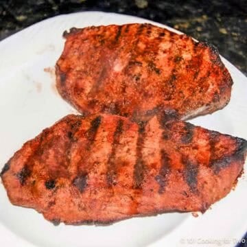 Two grilled sirloins on a plate.