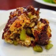 Sausage dressing on a white plate.