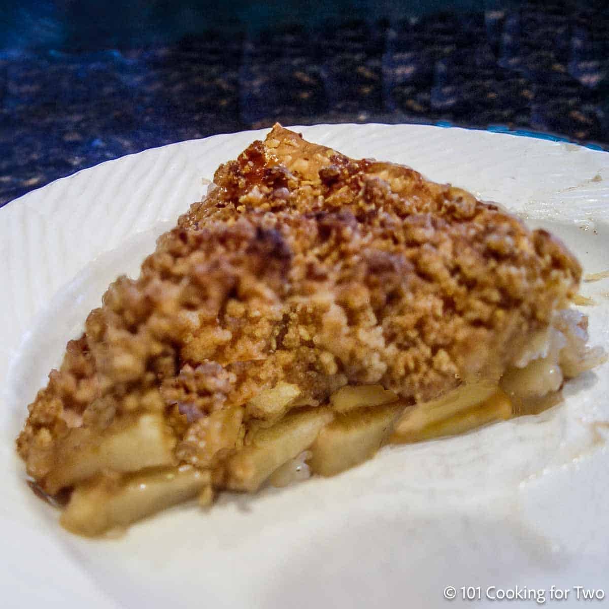 Slice of apple crumble pie.