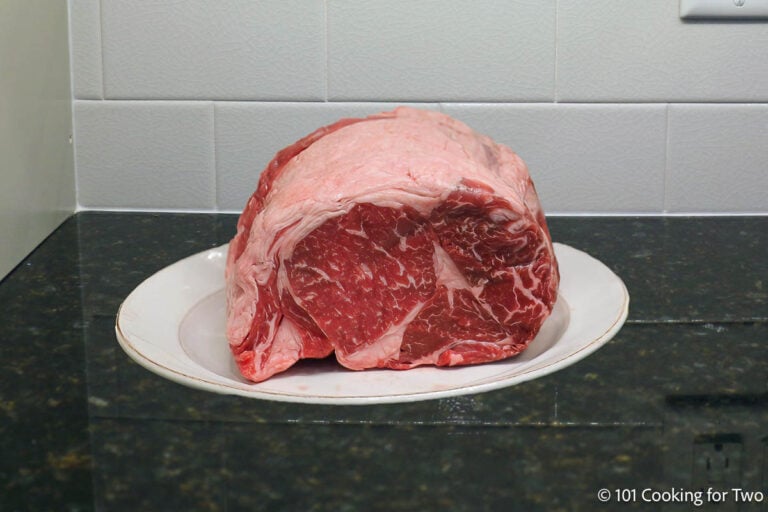Rib roast resting at room temperature.