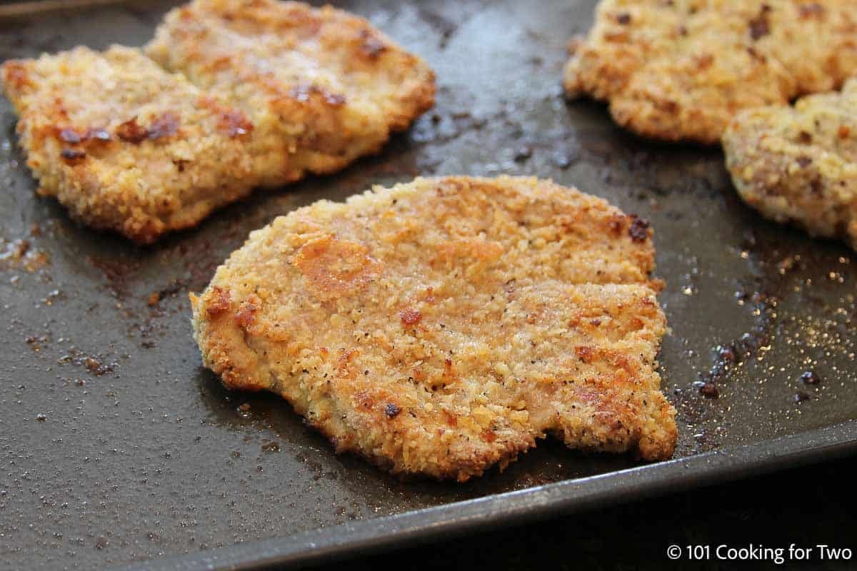 Browned breaded pork tenderloin on the tray.